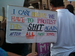 PROTEST POSTER AT WAR ON WOMEN RALLY